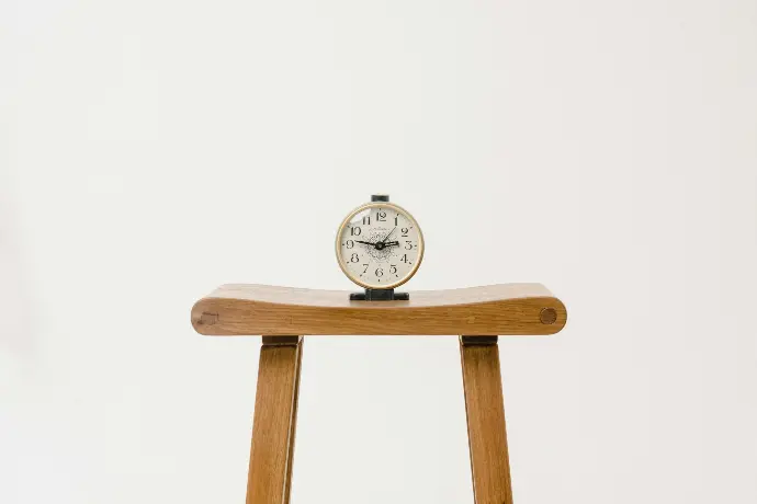 brown wooden table clock at 10 10